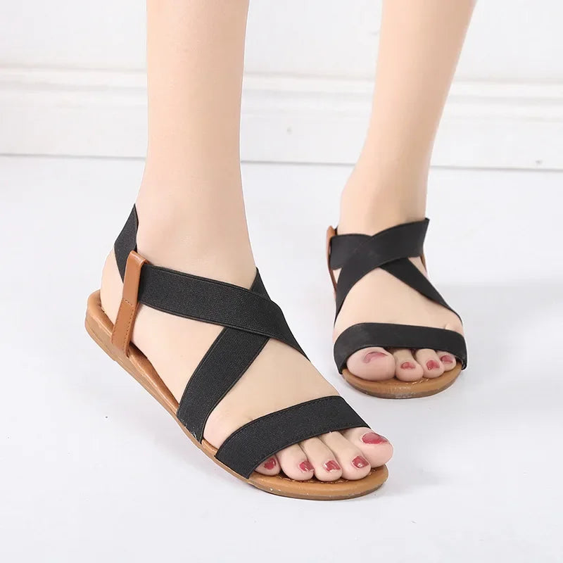 SANDALIAS PLANAS ROMANAS CON ELÁSTICO - AERELIS